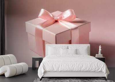 Minimal pink pastel color gift box or present box with pink ribbon bow isolated on light pink background with empty space minimalist conceptual Wall mural