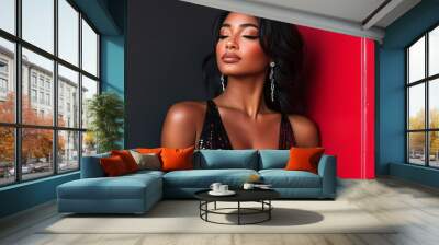 Glamour in the Spotlight:  A woman with dark skin and long black hair, adorned with sparkling earrings and a sequined dress, gazes thoughtfully in a captivating portrait against a backdrop of contrast Wall mural