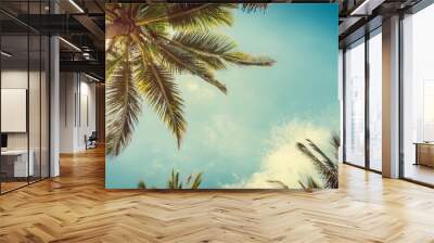 a blue sky and palm trees panorama from below as seen from the ground tropical travel banner with a vintage style Wall mural