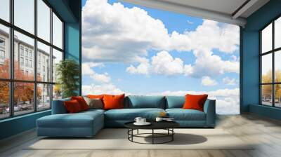 Clouds in s light blue sky Wall mural