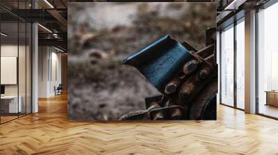 Close up shot of the digging teeth on a trenching machine  Wall mural