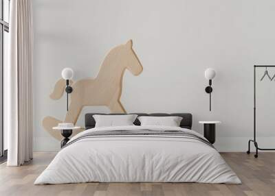 Minimalist wooden rocking horse on white surface – modern nursery decor concept Wall mural