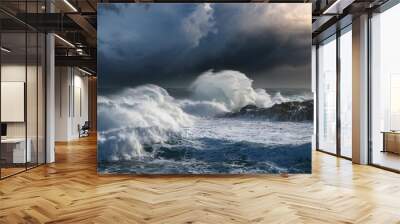 powerful ocean waves crash against the shore under a stormy sky creating a dramatic and intense seascape Wall mural