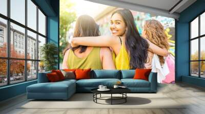 Beautiful woman embracing girl friends Wall mural