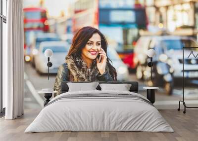 Indian woman talking on the phone in London Wall mural