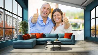 Mature Couple Showing Thumbs Up Wall mural