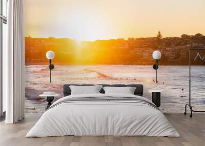 Sunrise on the beach with surfers Wall mural