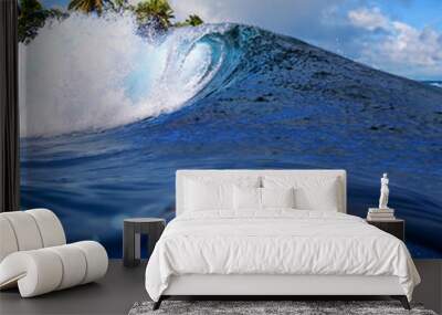 Perfect tropical ocean view splitted by waterline to two part. Shorebreak  breaking surfing wave. Palms and clouds in daylight with colorful rainbow. Wall mural