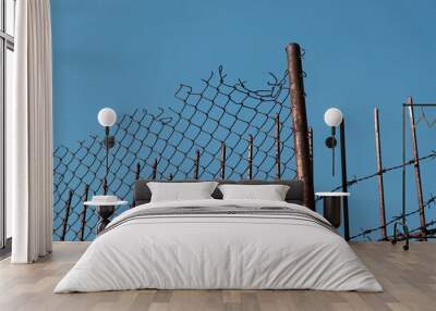 barbed wire fence against blue sky Wall mural