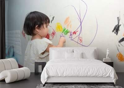  little baby boy and girl drawing with crayon color on the wall Wall mural