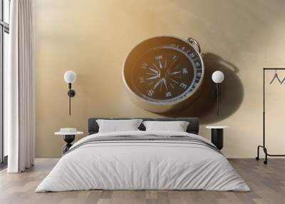 Compass on wood table. Wall mural