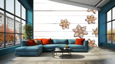 Christmas homemade gingerbread snowflakes on white wooden background. Wall mural