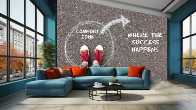 Exit from the comfort zone concept. Feet  standing inside circle comfort zone and outward arrow chalky on the asphalt. Wall mural