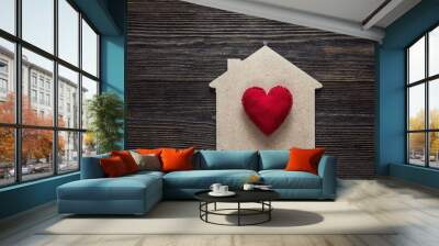 Home symbol with red heart shape on wooden background. Wall mural