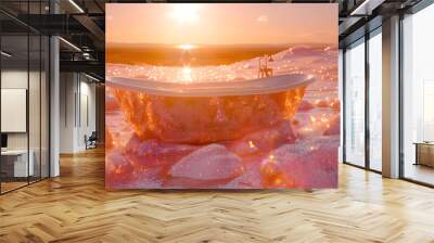 A luxury glitter bathtub sits in the middle of a field of flowers and sand dunes. The sun is setting and the sky is a warm yellow color. Wall mural