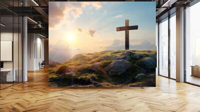 A wooden cross is placed on top of a rocky hill. The sky is blue with white clouds and a bright sun is shining  Wall mural