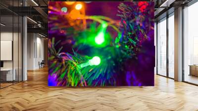 Christmas background-garlands with colorful lights on a decorated Christmas tree, bokeh Wall mural