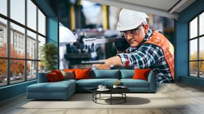  Male engineer metalworker industrial experienced operator technician worker in safety hard helmet working on lathe machine, professional man in industry technology manufacturing factory workshop Wall mural