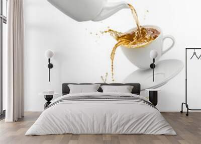 teapot pouring tea into flying cups, on white background Wall mural