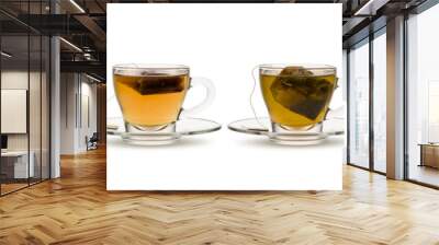 variety of tea and herbal teas in glass cups with tea bag inside, on white background Wall mural