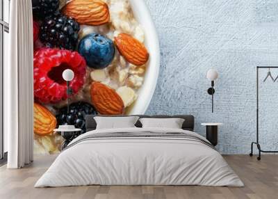 A healthy breakfast bowl filled with oats, fresh berries, and nuts, perfect for energizing your day and boosting nutrition. Wall mural