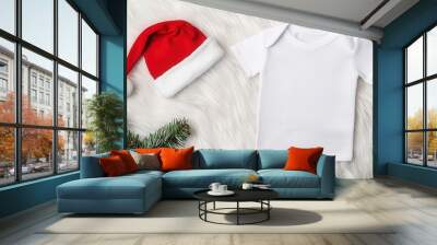 Baby T-shirt with snowman design on a white fur rug, Christmas Mockup, Soft and festive holiday vibe Wall mural