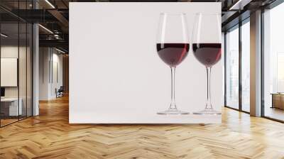 Elegant red wine glasses filled with rich red wine on a minimalist background, perfect for romantic or celebratory occasions. Wall mural