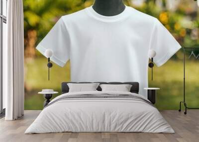 White kids' T-shirt on a mannequin with a park in the background, Kids T-Shirt Mockup, Outdoor and realistic setting Wall mural