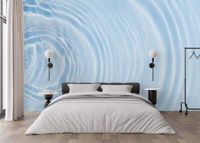 abstract flowing water wave from above, sun lights in bright blue water surface, beautiful fresh concept for body care, cosmetics, pharmacy or drink with copy space Wall mural