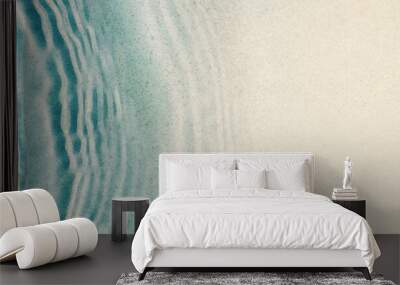 transparent blue water wave on sand beach with sunlight reflections from above, abstract blank beach background banner with copy space for summer holidays, travel and vacation Wall mural