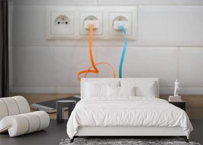 power plug into  power socket, charging 
 Wall mural