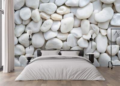 Background of white smooth pebble stones, close up Wall mural