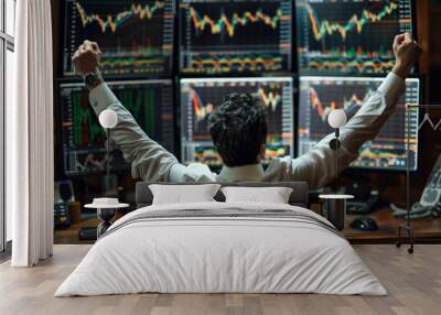 business man congratulations stock trader sitting at a desk in front of computer monitors Wall mural