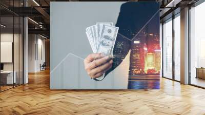 Double exposure of Businessman with money in hand, US dollar (USD) bills - investment, success and profitable business concepts Wall mural