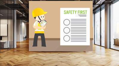 Man Safety inspector hold board checklist of industrial plants Standing inspection in front of the safety first paper workplace for safety first concept Wall mural