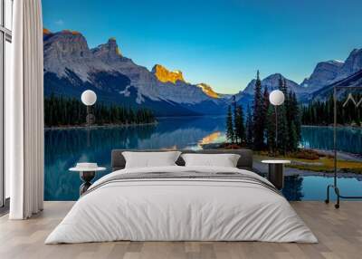 a tranquil mountain lake, surrounded by majestic snow-capped mountains, Morine lake Canada Wall mural