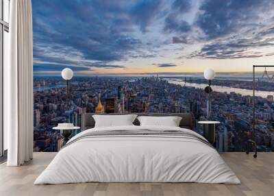 Aerial view of New York City skyline at sunset with dramatic clouds and the Hudson River Wall mural