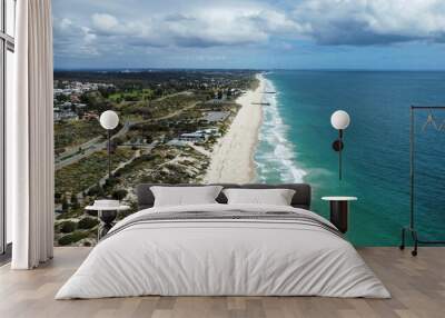 Aerial view of sandy beach with soft ocean waves Wall mural