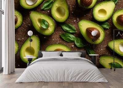 an overhead shot of a table with a cut avocado Wall mural