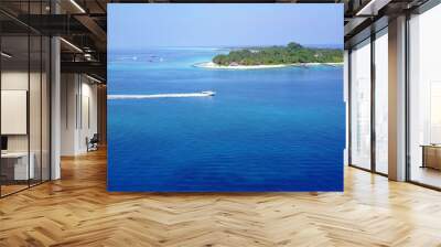 Beautiful view of a sea with an island on a sunny day Wall mural