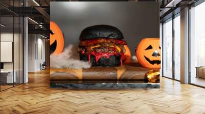 Halloween burger with black bun and decorations. Wall mural