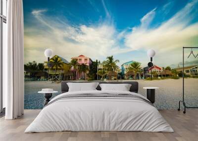 Houses near a beach against a cloudy sky in Estero Island, Florida Wall mural