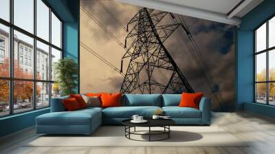 Low angle shot of a high-voltage power line cutting across a dramatic sky Wall mural