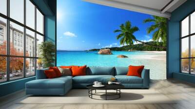 Scenic view of a tranquil, sandy beach and turquoise blue ocean waters Wall mural