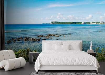 Scenic view of fluffy white clouds over sandy Tumon Beach, Guam, USA Wall mural