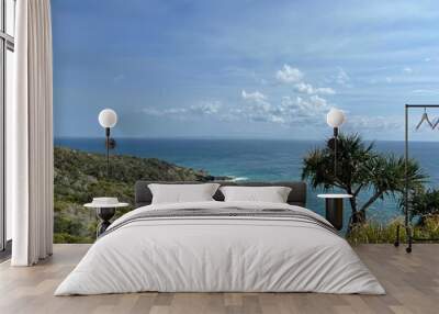 the Rainbow Beach covered by greens with blue water and blue clear sky on a sunny day in Australia Wall mural