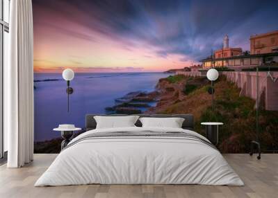 the sea is seen as it sits on the shore of a coast: Anzio Wall mural