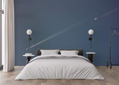 Two white aircrafts flying in the clear blue sky Wall mural