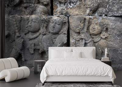 Wall with old historic stone statues in Borobudur Temple in Indonesia Wall mural