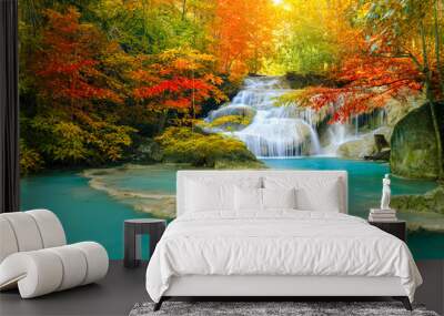 Colorful majestic waterfall in national park forest during autumn Wall mural